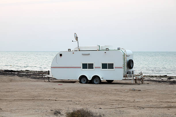 istock Trailer on the beach in Qatar 477704767