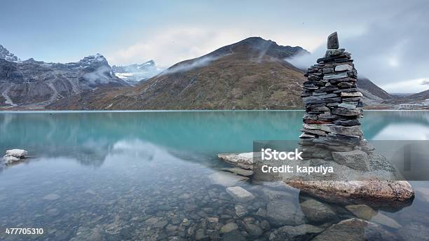 Green Lake Between Mountains In Cloudy Day Stock Photo - Download Image Now - Gokyo Lake, Gokyo Valley, 2015