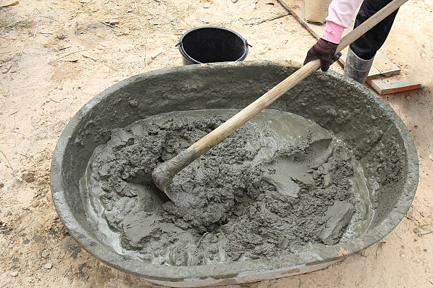 istock Mixing a cement in salver for applying construction 477705451