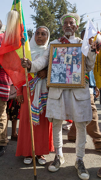 War veteran carries an album with pictures depicting his decor stock photo