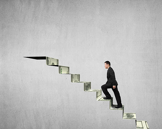 istock Walking on money stairs to top 477705975
