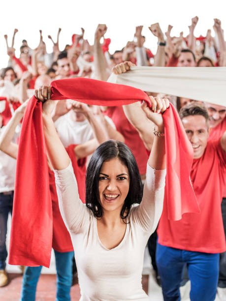 istock Cheerful young woman cheering and looking at camera. 477706250
