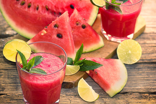 istock Two glasses of watermelon smoothies with lime and mint 477706540