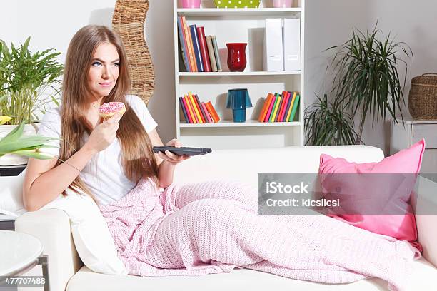 Happy Woman Watching Tv With Snack Stock Photo - Download Image Now - Candy, Eating, Sweet Food