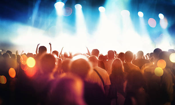 istock People at concert party. 477708014