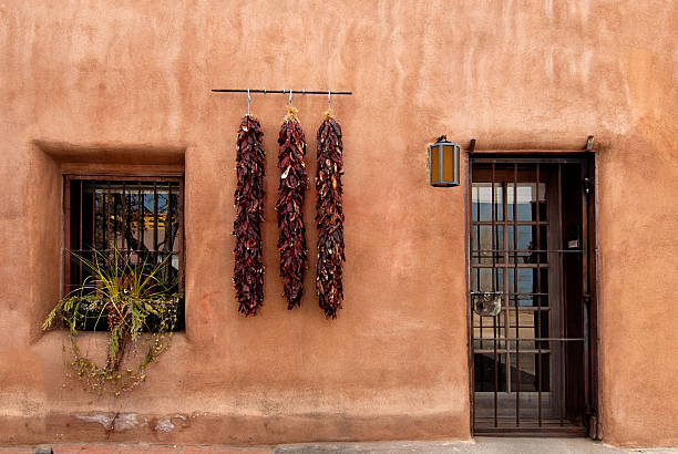 istock Old Santa Fe Style Adobe House and Chili Peppers 477710365