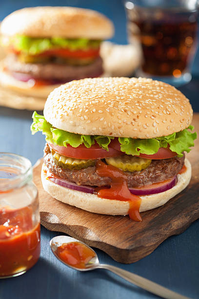 istock burger with beef patty lettuce onion tomato ketchup 477710440