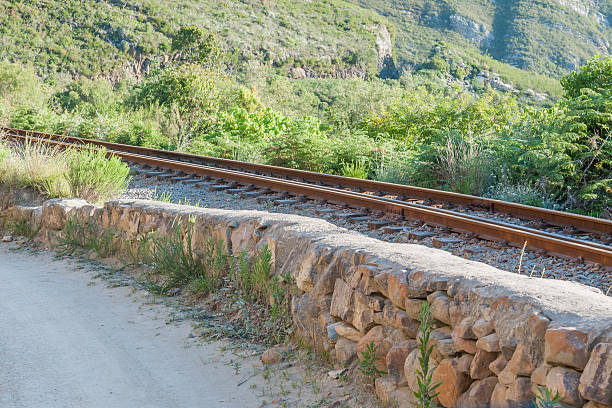 Railway and road in the Montagu Pass Railway next to the road in the Montagu Pass over the Outeniqua Mountains between Herold and George george south africa stock pictures, royalty-free photos & images