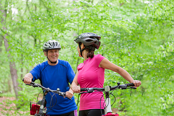 istock Mature couple cycling 477710612