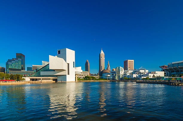 Cleveland waterfront skyline with museums Cleveland downtown waterfront skyline with the Rock and Roll Hall of Fame museum and the Great Lakes Science Center. cleveland ohio photos stock pictures, royalty-free photos & images