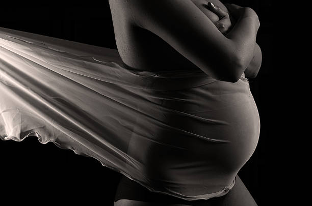 Pregnant woman in black and white stock photo