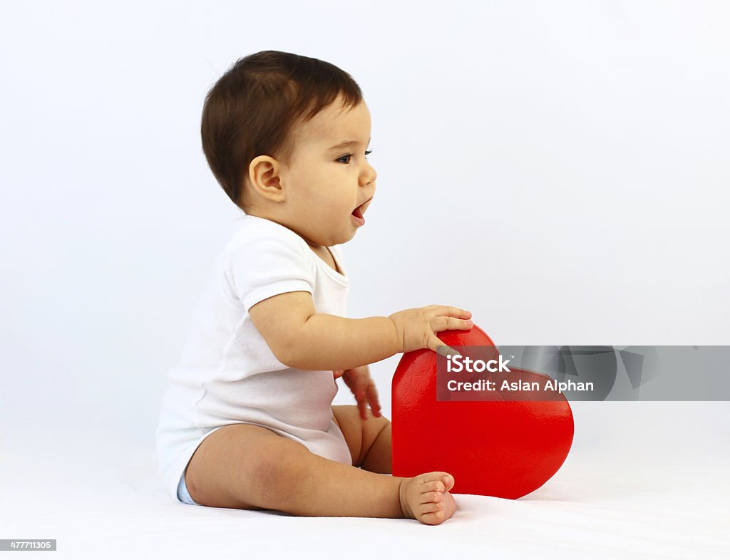 Baby holding a heart Baby - Human Age Stock Photo