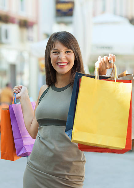 istock Happy woman shopping 477711421