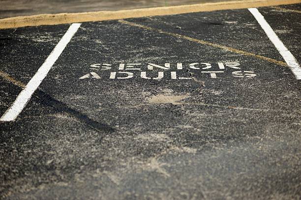 istock Senior adult parking space 477711853