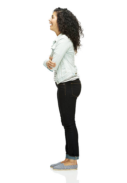 istock Smiling woman standing with arms crossed 477711973