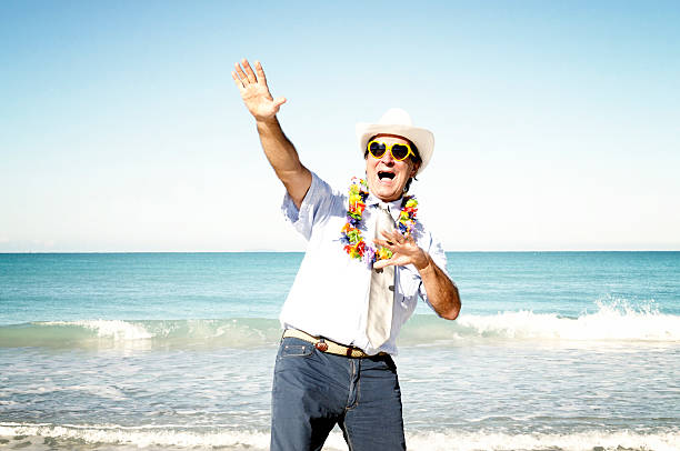 istock Businessman dancing by the sea 477712075