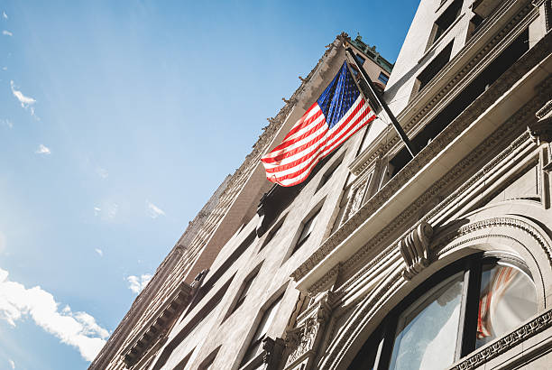 istock american flag on manhattan building 477713119