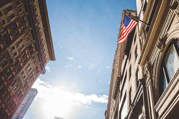 istock american flag on manhattan building 477713121