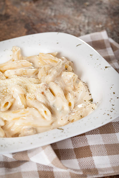 istock Penne with parmesan cheese sauce 477713916