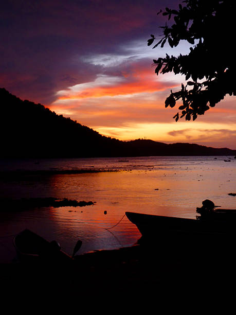 istock Intense Paradise dramatic red sky sunset over water 477714878
