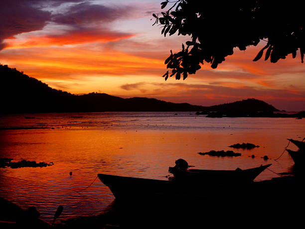istock Intense Paradise dramatic red sky sunset over water 477714884