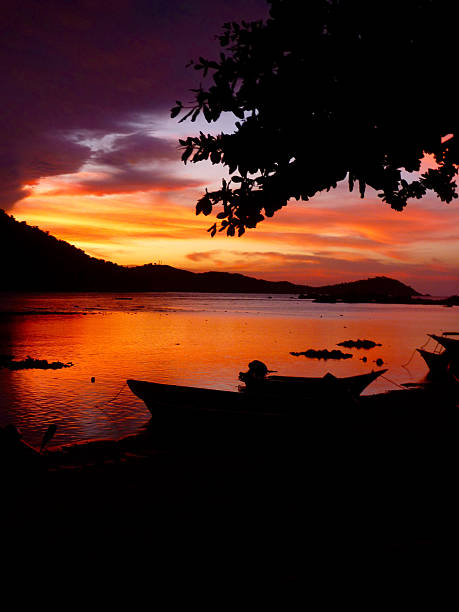 istock Intense Paradise dramatic red sky sunset over water 477714888