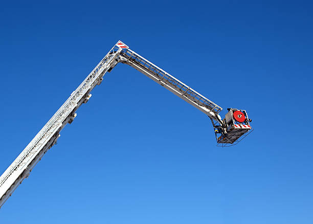 istock Fire carrycot with water cannon on a background blue sky 477715132
