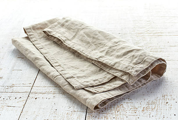 istock linen napkin on wooden table 477715680
