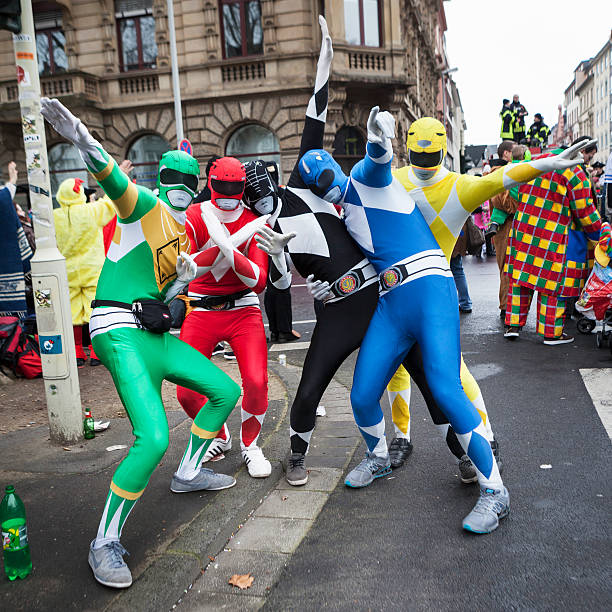 Mainz, Germany - March 3, 2014: Colourful costumed participants of Rose Monday parade posing in front of the camera in the city center of Mainz. Rosenmontagszug in Mainz is one of the largest and most famous carnival parades in Germany with approx. 500.000 spectators