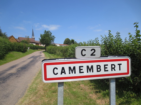 Road sign at entrance to the village of Camembert, Orne, France.