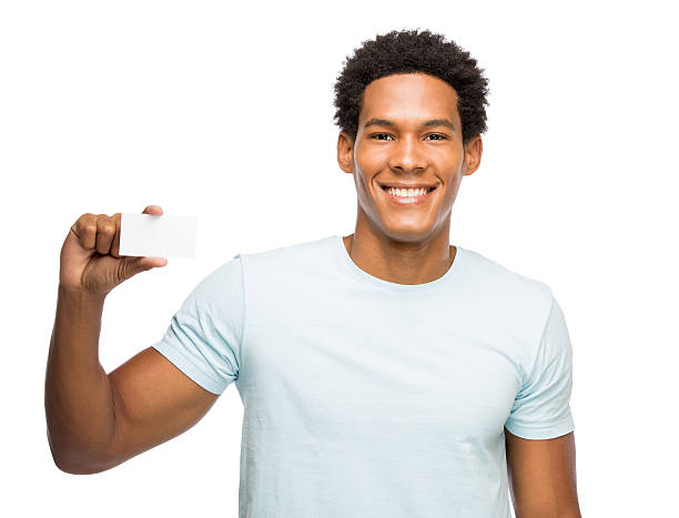 istock Casual young man holding up a business card 477719489