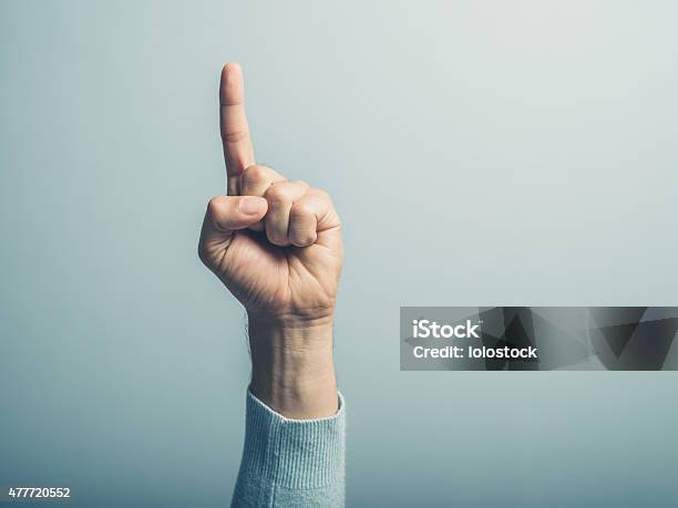 Male Hand With Finger Pointing Up Stock Photo - Download Image Now - Number 1, One Person, Pointing