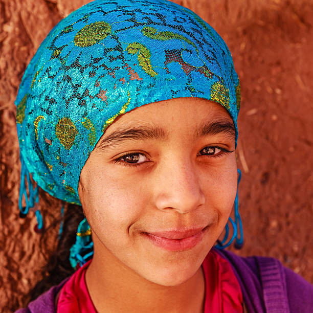 Beautiful Muslim girl in Moroccan kasbah Beautiful Muslim girl in Moroccan Village near Ouarzazate, Morocco, Africa moroccan girl stock pictures, royalty-free photos & images