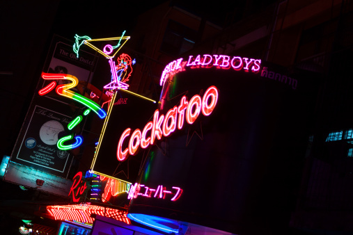 Bangkok, Thailand - March, 3rd 2014: Neon lights of Cockatoo ladyboy bar in Soi Cowboy. Night shot.