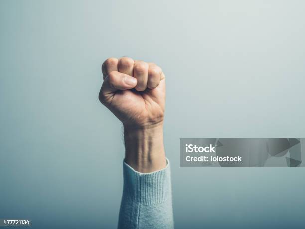 Fist In The Air Stock Photo - Download Image Now - Courage, Punching The Air, Authority