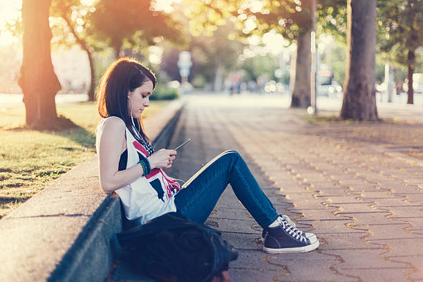 istock Girl texting on smartphone 477721314