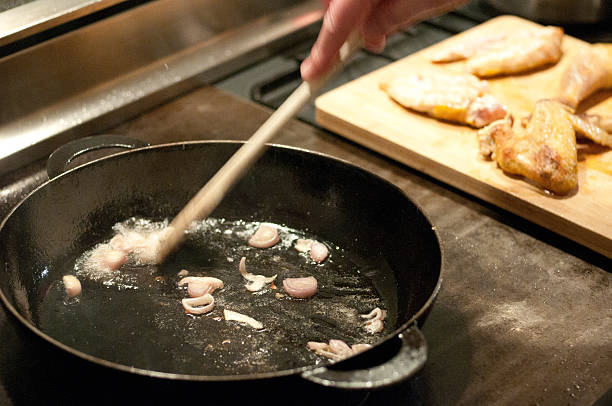 istock stiring frying gravy in a pan, motion blur 477721360