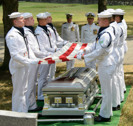 Arlington, VA USA - August 20, 2013: Military Funeral at Arlington National Cemetery with full Military Honors as performed by the US Navy for the funeral of a US Naval Captain.