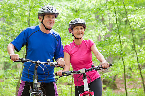 istock Mature couple cycling 477721568