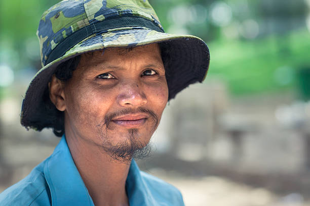Cambodian farmer Portrait of middle aged cambodian farmer (30+). cambodian ethnicity stock pictures, royalty-free photos & images