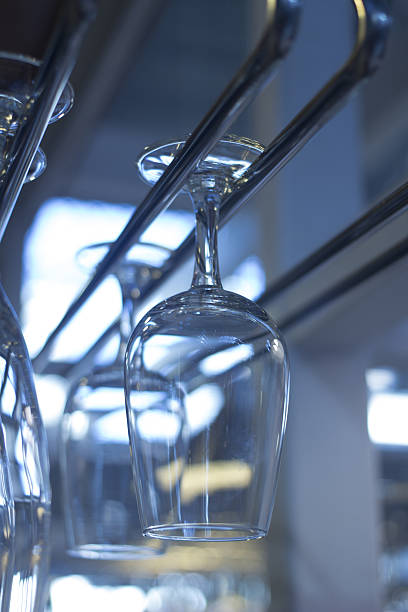istock Upturned wine glasses in restaurant bar close-up 477721854