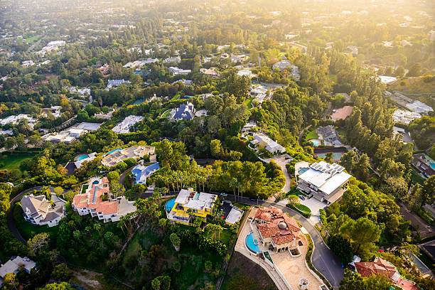 Beverly Hills mansions landscape aerial view -Los Angeles California Los Angeles California - Beverly Hills landscape and mansions aerial view late afternoon mansion stock pictures, royalty-free photos & images