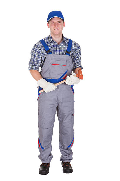 istock Happy plumber holding plunger 477722160