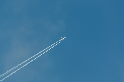 Plane with trail diagonally