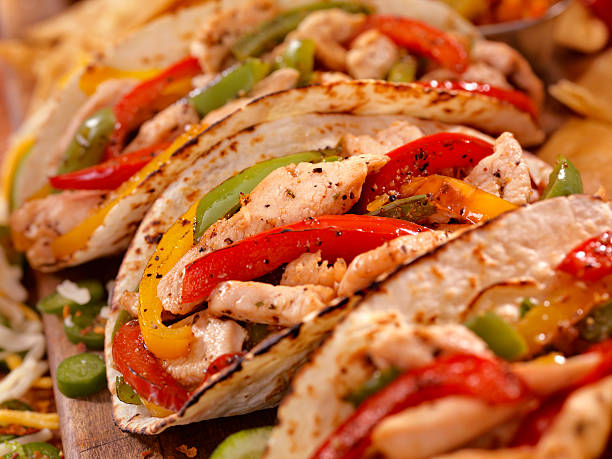 Chicken Fajitas Grilled Chicken Fajitas with Peppers - Photographed on Hasselblad H3D2-39mb Camera fajita photos stock pictures, royalty-free photos & images