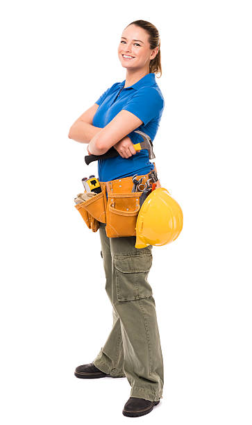 Woman Contractor Construction Worker Isolated on White Background Woman Contractor Construction Worker Isolated on White Background woman wearing tool belt stock pictures, royalty-free photos & images