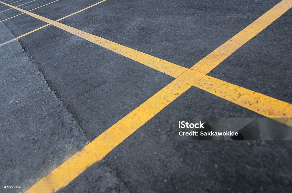 Parking Lot Lines On A Slight Angle Parking lot lines stretching across the image, with a gradient of yellow becoming less vibrant to the left. 2015 Stock Photo