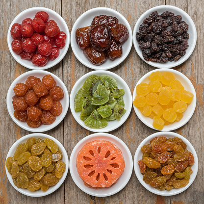 Collection of dried fruits put on a ceramic bowl