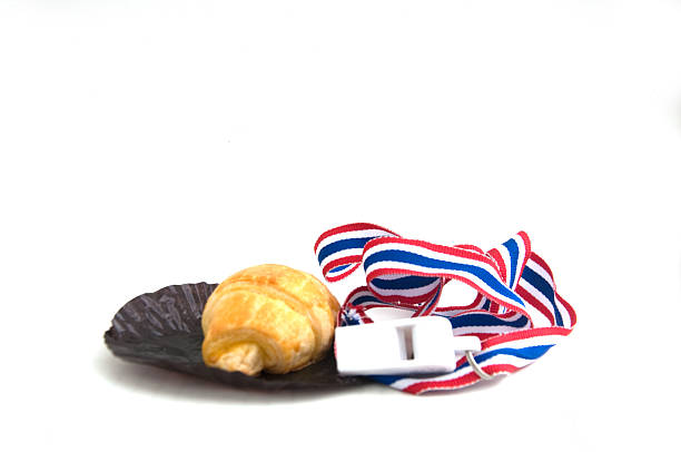 istock Croissant and Thai whistle - isolated on white 477726436