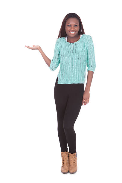 istock Woman holding invisible product against white background 477726454